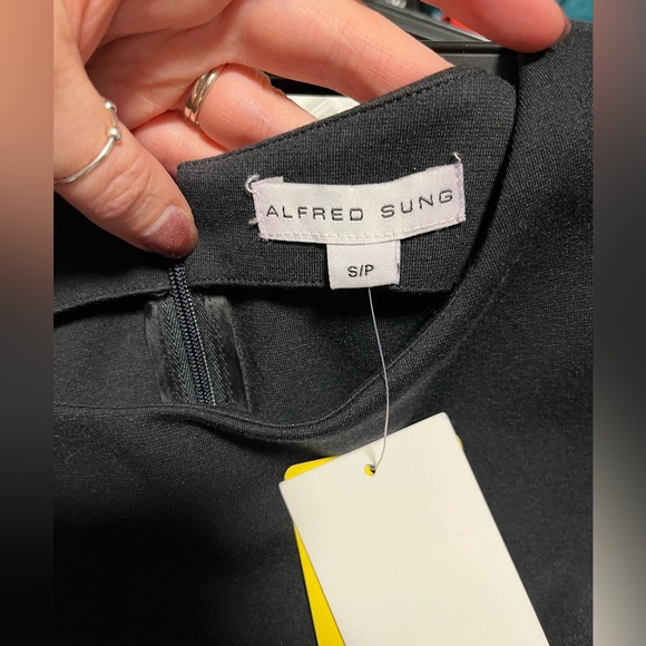 Black sleeveless dress, staple piece for office attire. - Picture 3 of 3